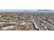 Scenic aerial shot of the property nestled in a residential area with a mountain range in the distance at 3008 Saint George St # F, North Las Vegas, NV 89030