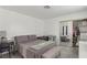 Bright bedroom with a comfortable bed, closet, and mirrored doors at 3008 Saint George St # F, North Las Vegas, NV 89030