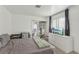 Bright bedroom with modern furniture, a closet, and natural light at 3008 Saint George St # F, North Las Vegas, NV 89030
