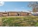 Charming single-story home with well-maintained lawn and lush landscaping providing curb appeal at 3008 Saint George St # F, North Las Vegas, NV 89030