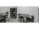 Comfortable living space features a desk, table and chairs and a dark bookshelf at 3008 Saint George St # F, North Las Vegas, NV 89030
