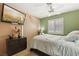 Cozy bedroom showcasing a ceiling fan, and light-blocking window shutters at 5580 Lonesome Biker Ln, Las Vegas, NV 89113