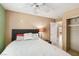Well lit bedroom featuring a ceiling fan and light-blocking window shutters at 5580 Lonesome Biker Ln, Las Vegas, NV 89113