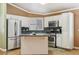 Bright kitchen featuring stainless steel appliances, granite counters, and a functional kitchen island at 5580 Lonesome Biker Ln, Las Vegas, NV 89113