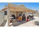 Covered patio with furniture and an outdoor storage unit at 5580 Lonesome Biker Ln, Las Vegas, NV 89113