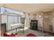 Back patio with dining and outdoor furniture, and outdoor storage at 5580 Lonesome Biker Ln, Las Vegas, NV 89113