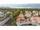 Aerial view of the neighborhood featuring tile roofs and mature trees at 9836 Russett Wood Cir, Las Vegas, NV 89117