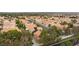 Wide aerial neighborhood view featuring tile roofs, mature trees, and well-maintained landscaping at 9836 Russett Wood Cir, Las Vegas, NV 89117