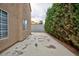 Side yard featuring stucco wall and concrete surface at 9836 Russett Wood Cir, Las Vegas, NV 89117