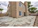 Backyard with tall block wall and large concrete patio at 9836 Russett Wood Cir, Las Vegas, NV 89117