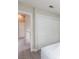 Bright bedroom featuring wood-look floors and a closet with sliding doors at 9836 Russett Wood Cir, Las Vegas, NV 89117