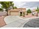 Well-maintained single-Gathering home with a two-car garage and a desert-landscaped front yard at 9836 Russett Wood Cir, Las Vegas, NV 89117