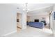 Open-concept living space with tile floors, comfortable seating, and sliding glass doors at 9836 Russett Wood Cir, Las Vegas, NV 89117