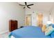 Inviting main bedroom featuring a vaulted ceiling, ceiling fan, and plenty of closet space at 9836 Russett Wood Cir, Las Vegas, NV 89117