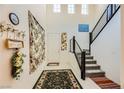 Bright foyer with soaring ceilings, stairway, and modern decor at 2705 Cava Tirreni St, Henderson, NV 89044