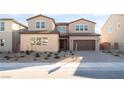 Two-story house with brown garage door and landscaped front yard at 5925 Flowering Hill Ct, Las Vegas, NV 89131