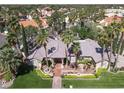 One-story home with tile roof, fountain, and palm trees at 1813 Skyline Dr, Las Vegas, NV 89117