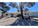 Charming single-story home featuring a xeriscaped yard, covered entrance, and a two car garage at 611 E Fairway Rd, Henderson, NV 89015