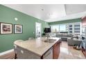 Well-appointed kitchen with an island, counter seating, and seamless connection to the living space and expansive windows at 4471 Dean Martin Dr # 2205, Las Vegas, NV 89103