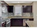 Kitchen with stainless steel appliances and mountain views at 8255 S Las Vegas Blvd # 1521, Las Vegas, NV 89123