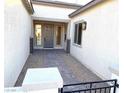 Covered entryway with tile flooring and a pathway leading to the front door at 5569 Artex Ave, Las Vegas, NV 89139