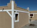 Side of home with unique desert architecture and rustic design at , Pahrump, NV 89060