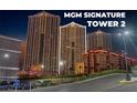 Night view of MGM Signature Tower 2, showcasing its modern architecture and city setting at 135 E Harmon Ave # 1020, Las Vegas, NV 89109