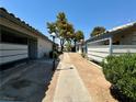 Quaint walkway view showcasing the property's charming architecture and serene surroundings at 213 N Lamb Blvd # D, Las Vegas, NV 89110