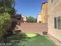 Artificial turf putting green and a wall at 9229 Millikan Ave, Las Vegas, NV 89148