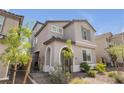 Inviting home featuring a well-kept yard with desert landscaping and manicured shrubbery at 10664 Sariah Skye Ave, Las Vegas, NV 89166