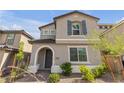 Charming two-story home with a well-maintained front yard, showcasing an inviting exterior at 10664 Sariah Skye Ave, Las Vegas, NV 89166