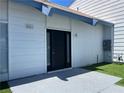 Exterior front door with artificial grass and a house number at 4281 White Sands Ave, Las Vegas, NV 89121