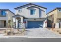 Well maintained two-story home with a blue garage door and landscaped front yard at 8351 Gold River Ct, Las Vegas, NV 89113