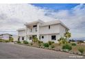 Modern two-story home with clean lines and desert landscaping at 7090 Fazio Dr, Las Vegas, NV 89110