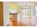 Kitchen features breakfast bar and sliding door to backyard at 9333 Leaping Deer Pl # 102, Las Vegas, NV 89178