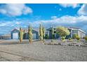 A view of the home's front yard, showcasing mature landscaping at 3301 Rodeo Ave, Pahrump, NV 89048