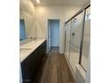 Bathroom boasts double sinks and a large walk-in shower at 1448 Nocturnal Flight St, Las Vegas, NV 89138