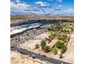 Aerial view showing home's location near school, stadium, and airport at 1860 E Ford Ave, Las Vegas, NV 89123