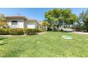 House exterior with manicured lawn at 1860 E Ford Ave, Las Vegas, NV 89123