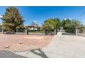 Front exterior of house with gated entrance at 1860 E Ford Ave, Las Vegas, NV 89123