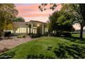 Back exterior of house showcasing a large covered patio area at 1860 E Ford Ave, Las Vegas, NV 89123