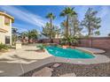 Inviting backyard oasis featuring a sparkling pool and spa at 7668 Gossamer Wind St, Las Vegas, NV 89139