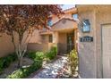 Townhouse entry with gated walkway and landscaping at 7132 Mission Hills Dr, Las Vegas, NV 89113