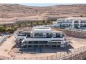 Luxury home under construction showcasing the structure, located in a desert landscape with mountain views at 12 Oakmont Hills Ln, Las Vegas, NV 89141