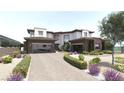 Beautiful modern home with stone accents, desert landscaping, and a brick driveway leading to two garages at 12 Oakmont Hills Ln, Las Vegas, NV 89141