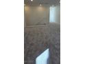 Upstairs loft featuring neutral gray carpet and white banister overlooking the stairs at 7086 Parkallen Ave, Las Vegas, NV 89113