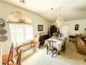 Spacious dining room with a chandelier and wood furniture at 1680 Landmark Ave, Pahrump, NV 89060