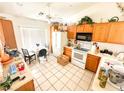 Bright kitchen features wood cabinets, and a breakfast nook at 1680 Landmark Ave, Pahrump, NV 89060