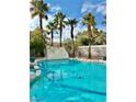 Inviting swimming pool with waterfall feature at 9917 Aspen Knoll Ct, Las Vegas, NV 89117
