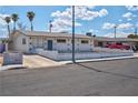Single story home with a long driveway and palm trees at 4313 El Conlon Ave, Las Vegas, NV 89102